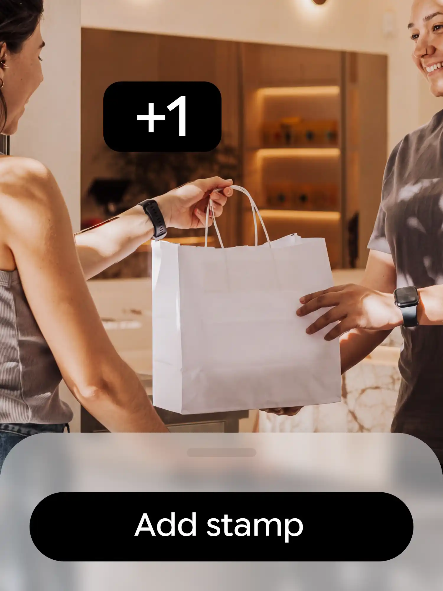 A bag handed over a counter with the Add stamp button and a +1 stamp